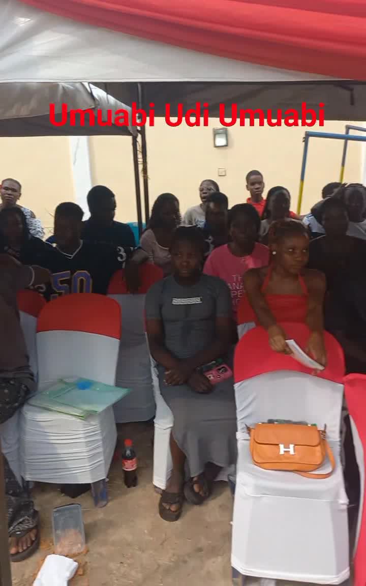 Community members seated under decorated canopies at a Darlstina Foundation outreach event
